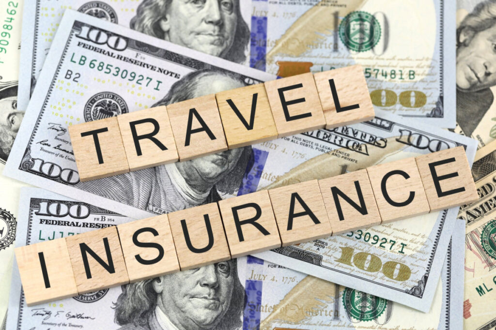 Travel insurance sign with dollar bills under it